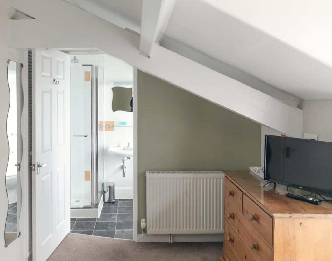 Guest room with door open to its en-suite bathroom